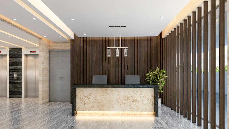 Lobby with a reception counter, a wood-paneled wall behind it and a wood slat wall beside it